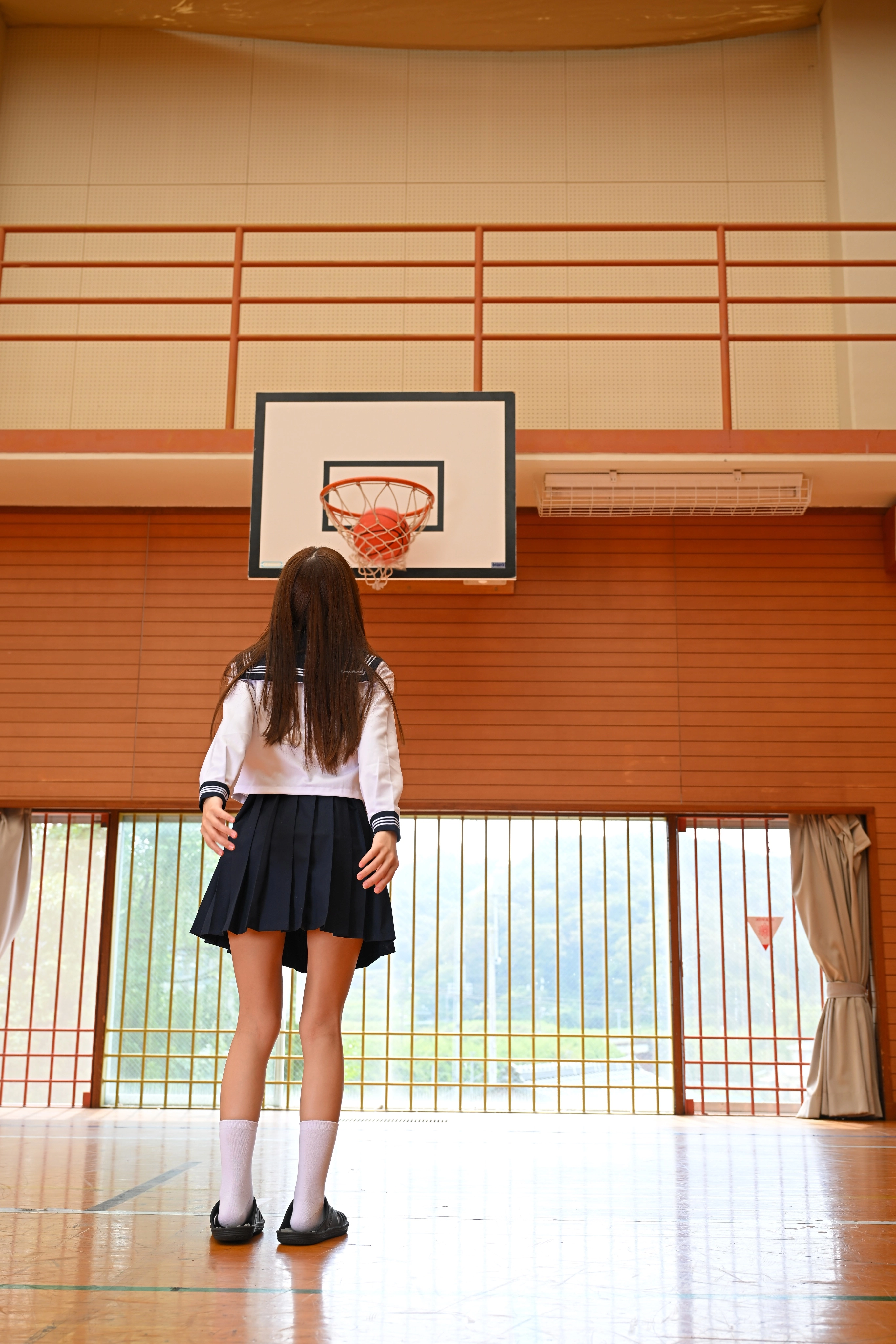 Shooting baskets.