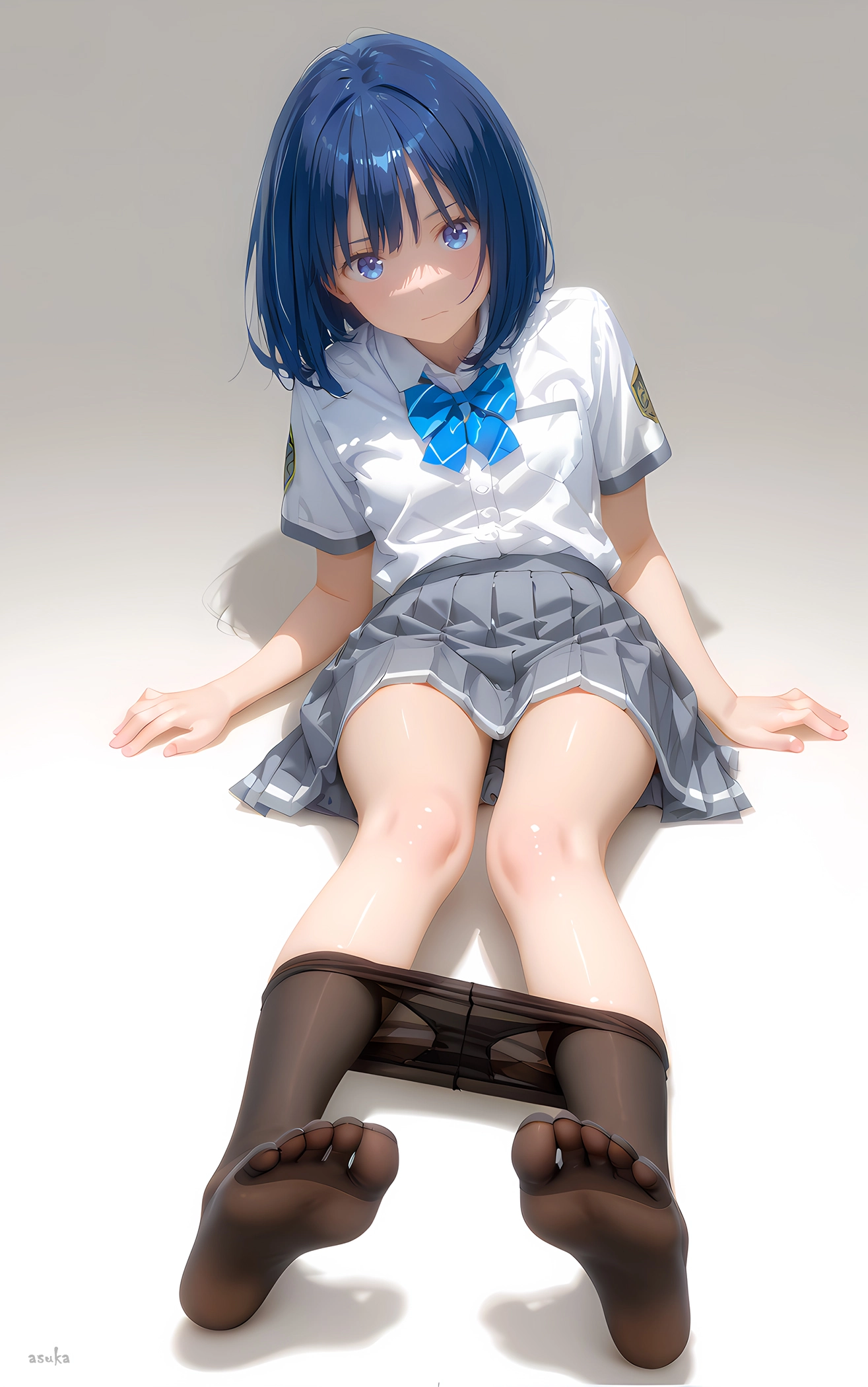 蓝眼睛和头发中的蓝弓的女孩坐在地板上。