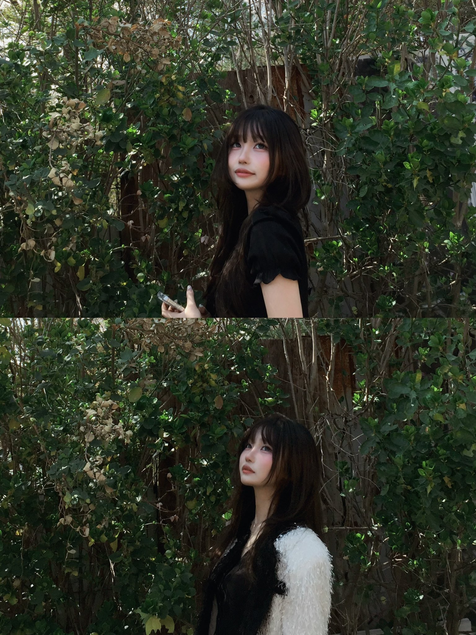 长头发和一件黑色衬衫的女人站在一棵树前。