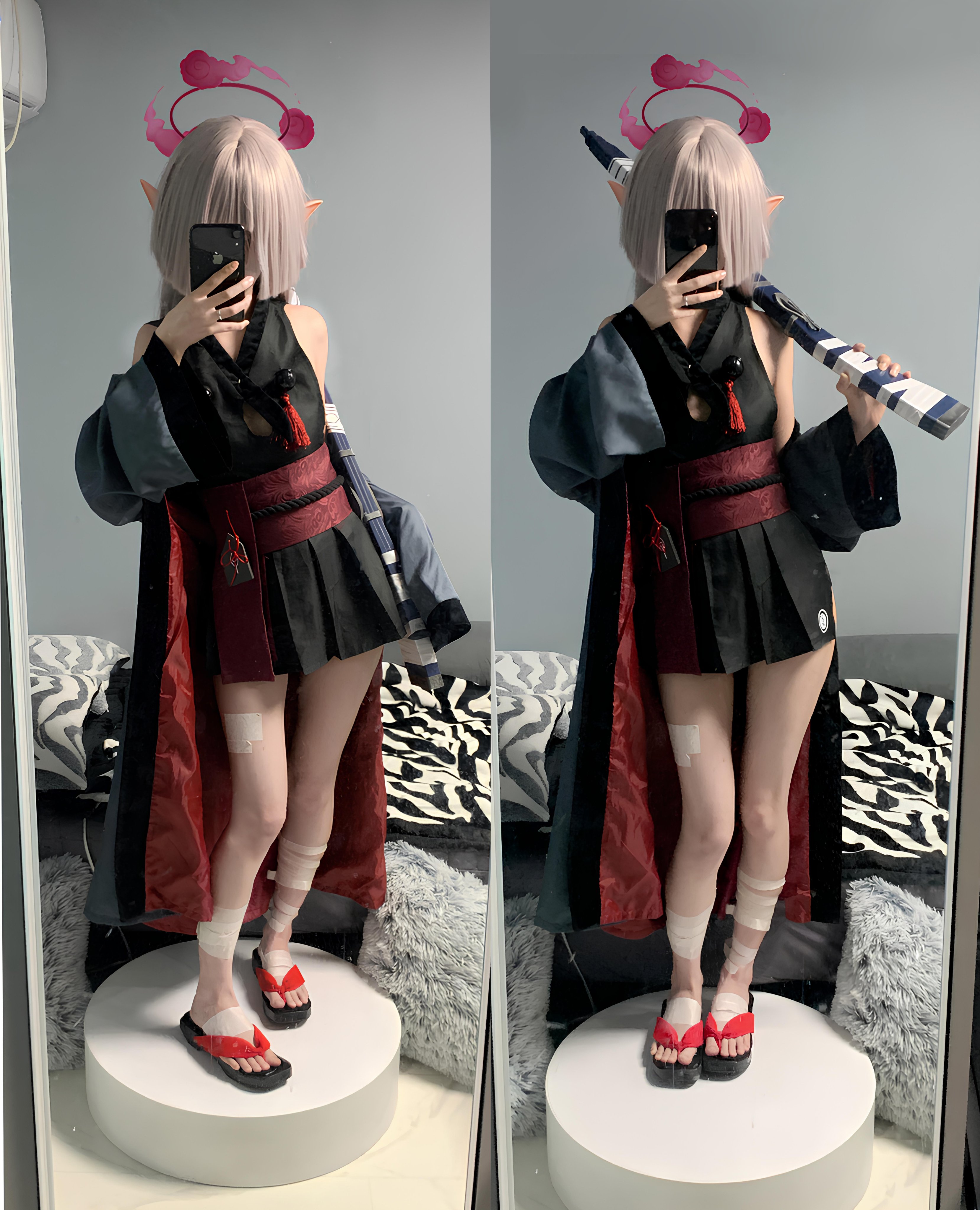 穿着黑色和红色衣服的女人拿着一把剑。