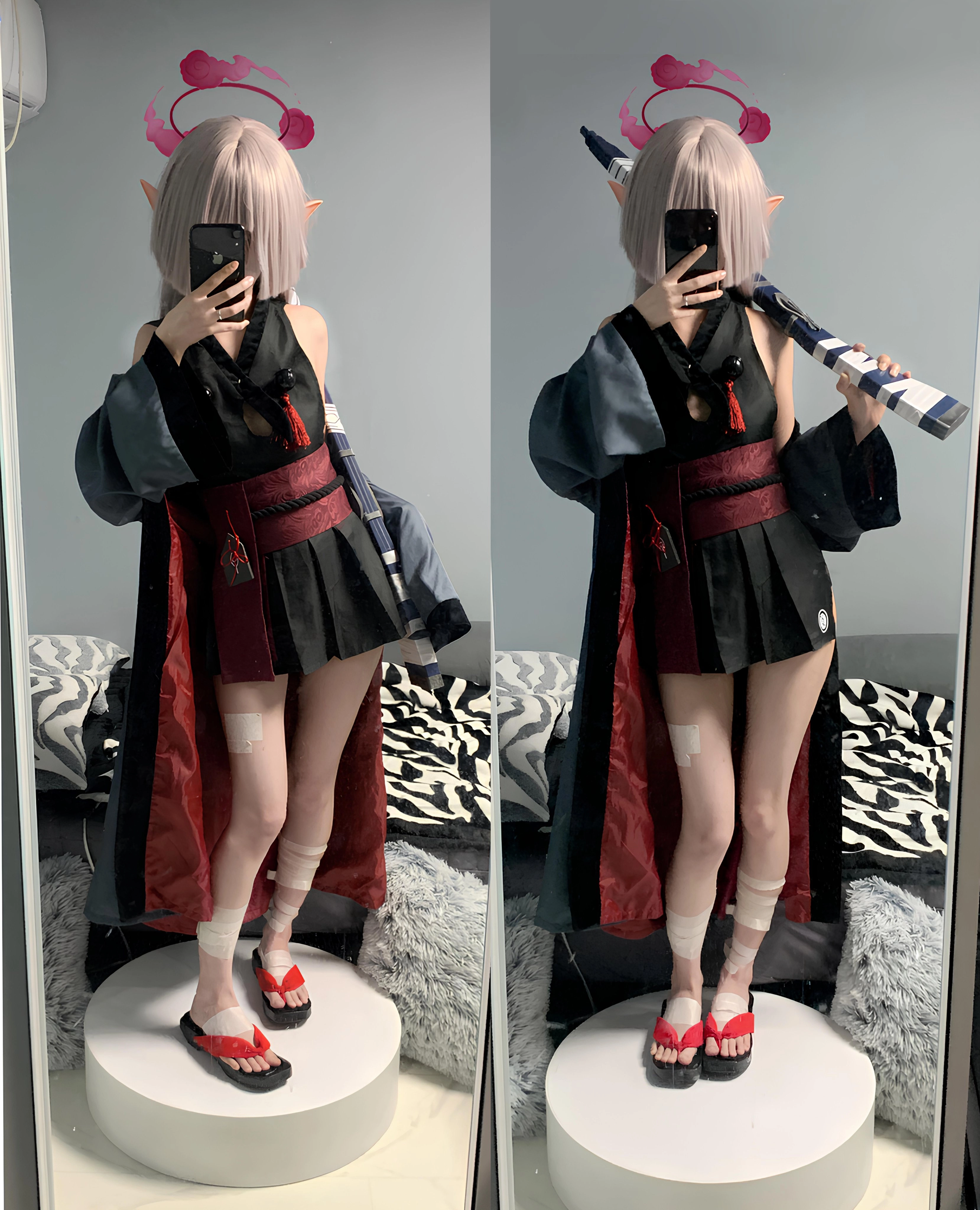 穿着黑色和红色衣服的女人拿着一把剑。