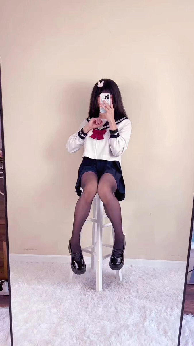 The girl took a photo of herself with her phone.