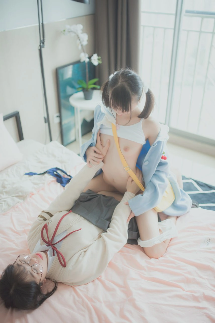 Two people have sex in bed.