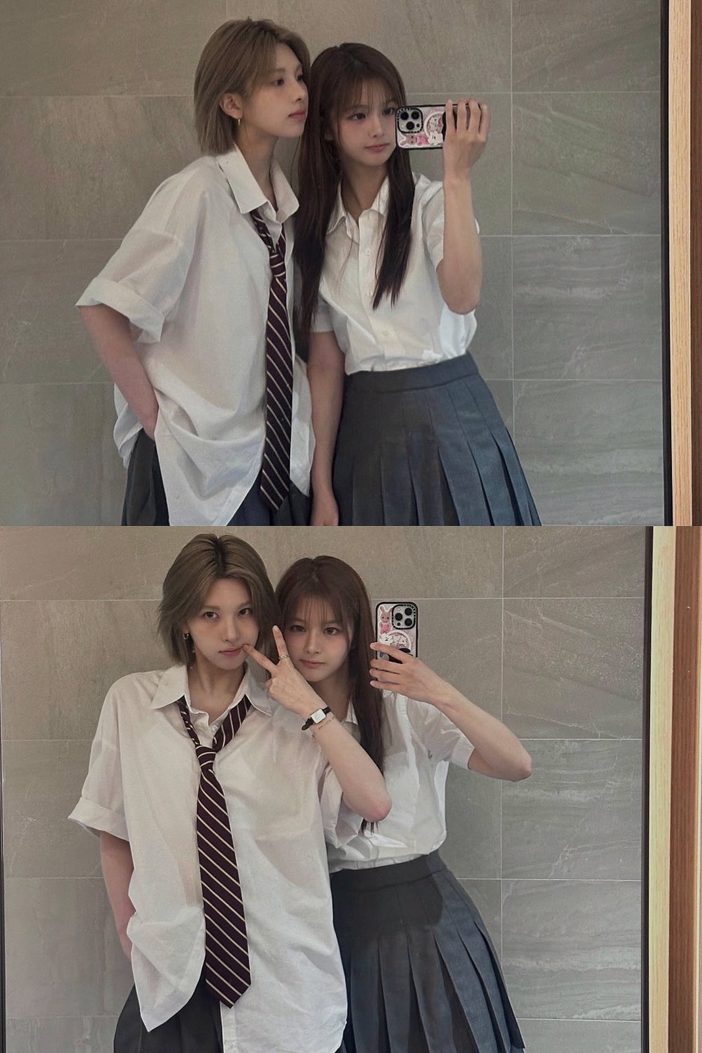 两个女孩在镜子前拍自拍。