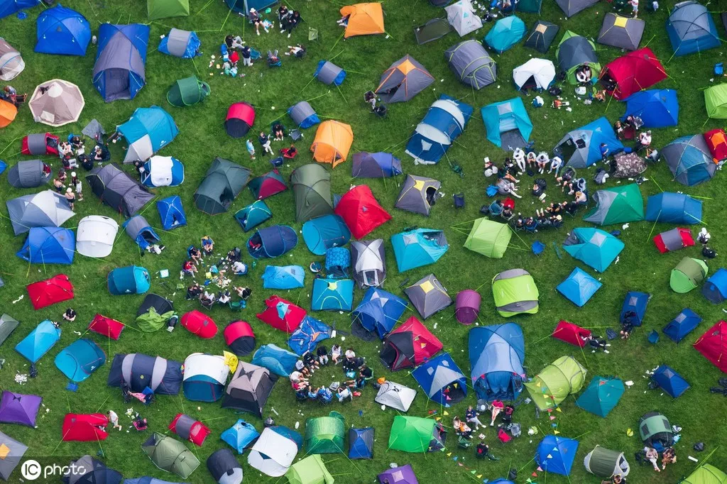 Camping craze sweeps the world as Americans are forced to set up tents near the suburbs 