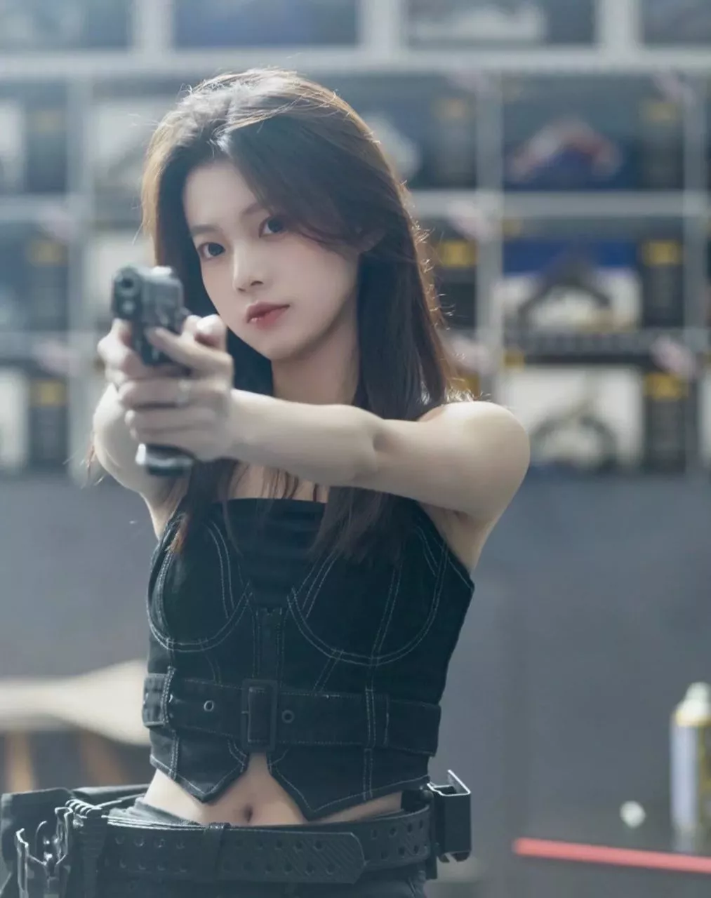 Beautiful woman with a gun.